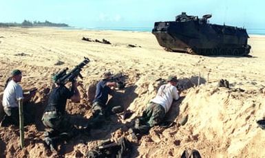 Marines from 3rd Battalion, 3rd Marines, India Company, role-play as an opposing force defending a third-world county at Pacific Missle Range Facility, Barking Sands, Kauai, Hawaii, against Marines from 11th Marine Expeditionary Unit, Camp Pendleton, California, who attacked with Assault Amphibious Vehicles (AAV) and Marines from the 11th MEUs Ground Combat Element during RIMPAC 96. The amphibious assault involved Navy and Marine air, ground and sea forces for training as a combined amphibious assault force