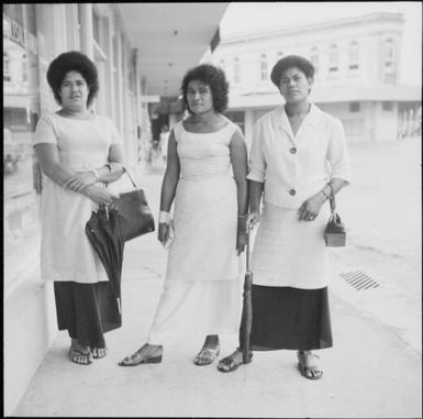 Three Fijian women standing near shopfronts, Fiji, November 1966 / Michael Terry