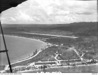 BORMAN AIRSTRIP, NEW GUINEA, 1945-09-12. AERIAL VIEW OF BORAM AIRSTRIP. IN THE AREA AROUND THE AIRSTRIP AND FOOTHILLS TO THE SOUTH 2/8 INFANTRY BATTALION ENCOUNTERED HEAVY OPPOSITION IN THE ADVANCE ..