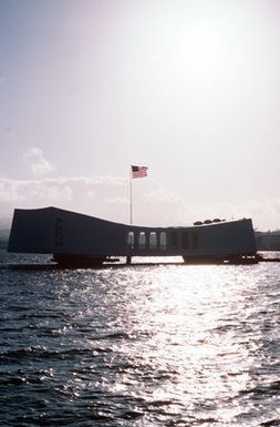 A silhouetted view of the USS ARIZONA Memorial as seen from Ford Island