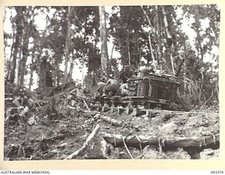 BARGES HILL, CENTRAL BOUGAINVILLE, 1945-06-26. TRUCKS ON THE WAY UP THE FUNICULAR RAILWAY WHICH IS BEING CONSTRUCTED BY 23 FIELD COMPANY, ROYAL AUSTRALIAN ENGINEERS, TO CARRY EQUIPMENT UP OVER ..