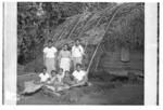 Peni Tāufa and family outside their house, Pētani village, Hahake.