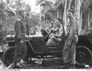 MILILAT, NEW GUINEA. 1944-08-13. THE CHIEF ENGINEER, AUSTRALIAN ELECTRICAL AND MECHANICAL ENGINEERS, HEADQUARTERS, 5TH DIVISION, NX34766 LIEUTENANT COLONEL A.V. TAYLOR (1); TALKING TO VX137730 ..