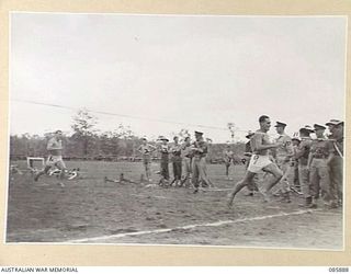 HERBERTON, QLD. 1945-01-20. WARRANT OFFICER II ARMITAGE, 7TH DIVISION, (9), WINNING THE 440 YARDS OPEN CHAMPIONSHIP WITH PRIVATE CREBER, 2/17TH INFANTRY BATTALION, (1), SECOND, AND PRIVATE LEANE, ..