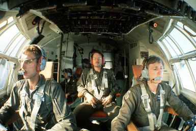 A WC-130 Hercules aircraft from the 54th Weather Reconnaissance Squadron on a mission to monitor and relay vital information on a typhoon to the Joint Typhoon Warning Center (JTWC)