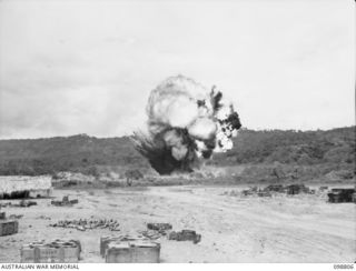 VULCAN, RABAUL AREA, NEW BRITAIN. 1945-11-14. THE FLASH CAUSED BY THE DESTRUCTION OF APPROXIMATELY 20 TONS OF JAPANESE AMMUNITION. IT WAS DESTROYED BY MEMBERS OF HEADQUARTERS 11 DIVISION