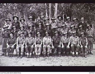 DOBODURA, NEW GUINEA. 1943-10-11. GROUP PORTRAIT OF MOTOR TRANSPORT PERSONNEL OF HEADQUARTERS, 11TH AUSTRALIAN DIVISION. LEFT TO RIGHT:- FRONT ROW:- NX80807 L A BUNDOCK; NX121669 DRIVER J R S KERR; ..