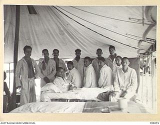 BORAM BEACH, NEW GUINEA. 1945-10-17. A GROUP OF INDIAN SOLDIERS, LIBERATED IN THE SEPIK RIVER AREA AND BROUGHT TO WEWAK FOR TREATMENT IN A HOSPITAL WARD OF 2/15 FIELD AMBULANCE. WITH GOOD MEDICAL ..