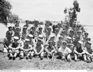 MADANG, NEW GUINEA. 1944-10-29. COMMANDER J.C. MORROW, DSO, DSC, RAN, AND MEMBERS OF HIS STAFF