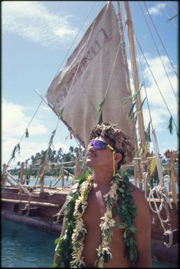 Man wearing sunglasses and leaf wreaths