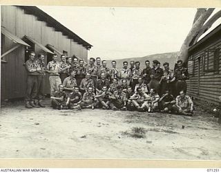 OONOONBA, QUEENSLAND, AUSTRALIA, 1944-03-11. A GROUP OF BRITISH OFFICERS WHO HAVE BEEN FIGHTING IN NEW GUINEA, PHOTOGRAPHED AT THE 13TH AUSTRALIAN PERSONNEL STAGING CAMP. MAJOR B.L.M. TOMLINSON, A ..