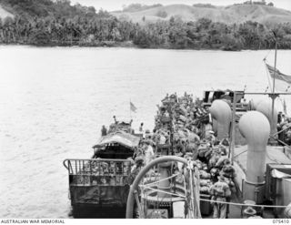 POTSDAM, NEW GUINEA. 1944-08-20. TROOPS OF THE 25TH INFANTRY BATTALION DISEMBARKING FROM THE RAN FRIGATE, HMAS "BARCOO" ON THEIR ARRIVAL FROM SIAR