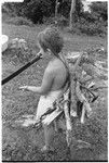 Lauren Keesing with a machete and load of firewood