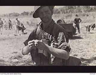 NADZAB AIRSTRIP, NEW GUINEA. 1943-09-19. NX29366 PRIVATE F. N. SMITH OF THE 2/33RD AUSTRALIAN INFANTRY BATTALION