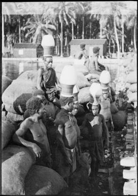 Five men wearing Ombu, ceremonial headwear, Soraken, Bougainville Island,  ca. 1929 / Sarah Chinnery