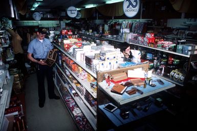 A sailor shops in the Navy Exchange at Santo Stefano, an island between the Sardinian coastal town of Palau and the island of La Maddalena. The exchange serves military personnel from Naval Station Maddalena, who must use a ferry to get to the island