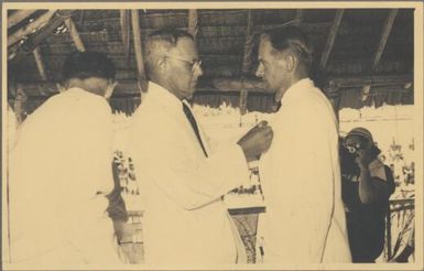 Brigadier Cleland decorates Tony Taylor for services, Popondetta, 1952 / Albert Speer