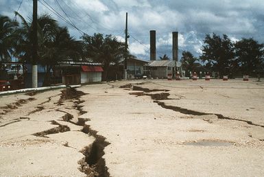 Cracks run through a parking lot in the aftermath of an earthquake that struck the region on August 8th