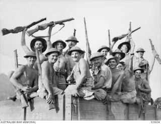 PORT MORESBY, PAPUA. 1942-07. TYPICAL OF THE BRONZED AUSTRALIANS READY TO MEET THE JAPANESE IN NEW GUINEA ARE THESE HAPPY-LOOKING SAPPERS. WHEN THE PHOTOGRAPHER WANTED THEM TO SMILE, HE SAID THAT ..