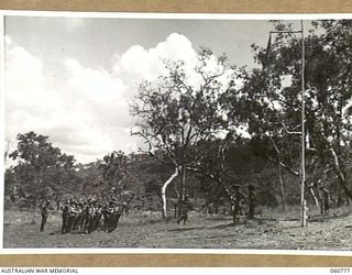 POM POM VALLEY, NEW GUINEA. 1943-11-27. GUARD OF THE 2/10TH AUSTRALIAN NFANTRY BATTALION, CHAMPIONS OF THE 18TH AUSTRALIAN INFANTRY BRIGADE, WAITING TO BE MARCHED ON TO THE PARADE GROUND FOR THE ..