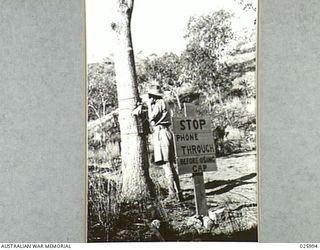 PAPUA, NEW GUINEA. 1942-07-20. HASTILY CONSTRUCTED ROADS THROUGH MOUNTAINOUS AREAS IN NEW GUINEA ARE MOSTLY ONLY SINGLE TRACK WIDTH. TO ENSURE THAT VEHICLES WILL NOT MEET HEAD ON, A TELEPHONE HAS ..