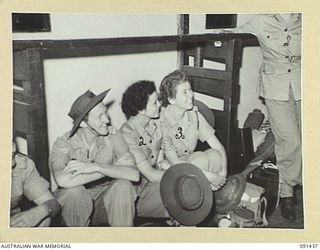 LAE, NEW GUINEA, 1945-05-07. AUSTRALIAN WOMEN'S ARMY SERVICE PERSONNEL AWAITING THEIR CALL TO DISEMBARK FROM THE MV DUNTROON. THEY ARE PART OF A GROUP OF 342 AUSTRALIAN WOMEN'S ARMY SERVICE FROM ..