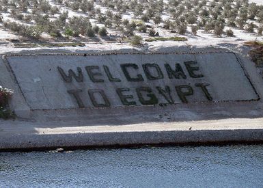 A large"WELCOME TO EGYPT"sign is seen from the U.S. Navy Tarawa Class Amphibious Assault Ship USS SAIPAN (LHA 2) as it transits through the Suez Canal in Egypt on Sept. 2, 2006. SAIPAN is currently underway conducting maritime security operations. (U.S. Navy photo by Mass Communication SPECIALIST SEAMAN Patrick W. Mullen III) (Released)