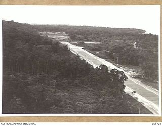 HUON PENINSULA, NEW GUINEA. 1943-12-05. A NEW AIRSTRIP BUILT AT AN ADVANCED POINT IN HEAVILY WOODED COUNTRY ON THE COAST