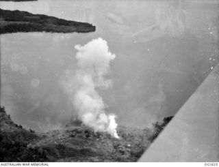 WEWAK AREA, NORTH EAST NEW GUINEA. C. 1944-10. AERIAL VIEW OF SMOKE BILLOWING FROM COASTLINE TARGETS IN THE WEWAK AREA SET ON FIRE IN AN AIR ATTACK BY AIRCRAFT OF NO. 8 (BEAUFORT) SQUADRON RAAF