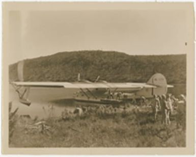 [Dayak people unloading cargo from Consolidated PBY flying boat "Guba"]