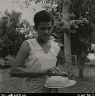 Young woman holding plate of food