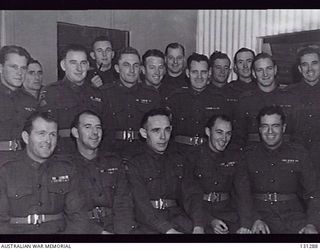 ROYAL PARK CAMP, VIC. 1946-09-06. QX20656 PRIVATE RICHARD KELLIHER VC, 2/25TH BATTALION (CENTRE FRONT). PRIVATE KELLIHER WAS AWARDED THE VICTORIA CROSS FOR BRAVERY AT HEATH PLANTATION NEAR LAE, NEW ..