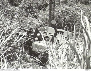 MADANG, NEW GUINEA. 1944-10. A CHURCHILL VII TANK ENGAGED IN ITS SECOND ATTEMPT AT COURSE NO. 3 DURING TESTS CONDUCTED AT HQ 4 ARMOURED BRIGADE