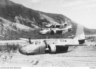 NEAR PORT MORESBY, PAPUA. C. 1942-12. THREE BOSTON BOMBER AIRCRAFT OF NO. 22 SQUADRON RAAF RETURN TO THEIR BASE AT PORT MORESBY IN PERFECT FORMATION AFTER A SUCCESSFUL STRIKE. IN THE BACKGR0UND IS ..