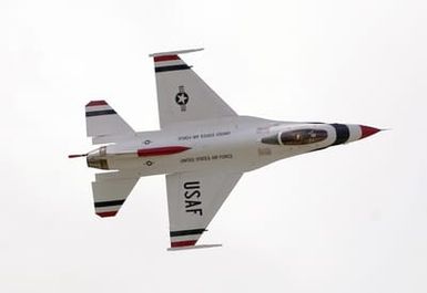 A U.S. Air Force Thunderbirds Aerial Demonstration Team F-16C Fighting Falcon aircraft performs during a performance for the Open House Air Show, Sept. 12, 2004, at Andersen Air Force Base, Guam. (U.S. Air Force PHOTO by STAFF SGT. Bennie J. Davis III) (Released)