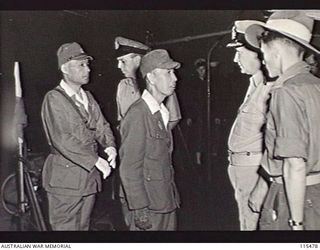 AT SEA, BOUGAINVILLE AREA. 1945-09-08. LIEUTENANT-GENERAL (LT-GEN) M. KANDA, COMMANDER, 17TH JAPANESE ARMY (2) ADDRESSING COMMANDER A. E. FOWLER, RAN, REPRESENTING LT-GEN S. G. SAVIGE, GENERAL ..