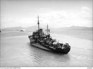 PORT MORESBY, PAPUA. 1942-09. H.M.A.S. BENDIGO IN PORT MORESBY HARBOUR AFTER ESCORTING A CONVOY OF TROOPSHIPS AND SUPPLY VESSELS FROM AUSTRALIA
