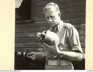 LITTLE EDIE CREEK, NEW GUINEA, 1944-02-25. QX22008 CAPTAIN F.W. WHITEHOUSE, A LECTURER IN GEOLOGY AT QUEENSLAND UNIVERSITY PRIOR TO ENLISTMENT IS AND PRESENT THE ACTING ADJUTANT OF THE COMMANDER ..