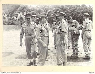 TOROKINA, BOUGAINVILLE. 1945-04-11. SENATOR J.M. FRASER, ACTING MINISTER FOR THE ARMY (2), AND LT-GEN J. NORTHCOTT, CHIEF OF THE GENERAL STAFF (1), SAYING GOODBYE TO LT-GEN S.G. SAVIGE AND OFFICERS ..