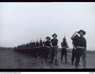 VUNAKANAU, NEW BRITAIN, 1946-02-12. FIRST FULL REGIMENTAL PARADE OF THE PACIFIC ISLANDS REGIMENT AS ONE COMPLETE UNIT. UNTIL THE WAR ENDED COMPANIES AND PLATOONS SERVED IN MANY DIFFERENT AREAS. ..