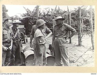 TOROKINA, BOUGAINVILLE. 1945-09-14. AUSTRALIAN OFFICER QUESTIONING ONE OF THE PARTY OF 79 CHINESE WHO ARRIVED BY TRUCK AT TOROKINA COMPOUND. FORMER PRISONERS OF THE JAPANESE THEY WERE RELEASED WHEN ..