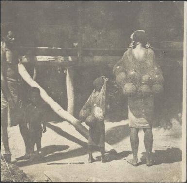 Woman and girl with bilums of coconut shells filled with water, Kila, Salamaua, New Guinea, 1933 / Sarah Chinnery