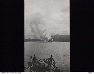 ORO BAY, NEW GUINEA. 1943-03-28. THE DUTCH TRANSPORT BANTAM SINKING AFTER BEING BOMBED DURING A JAPANESE AIR ATTACK WHILE TAKING PART IN OPERATION LILLIPUT. (NAVAL HISTORICAL COLLECTION)