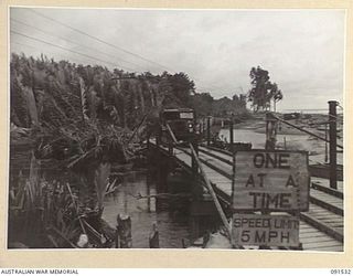 BOUGAINVILLE. 1945-05-02. A GENERAL VIEW OF THE FLOATING BOAT EQUIPMENT BRIDGE OVER THE LAGOON ON THE MOTUPENA POINT - TOKO ROAD, CONSTRUCTED BY 5 FIELD COMPANY, ROYAL AUSTRALIAN ENGINEERS