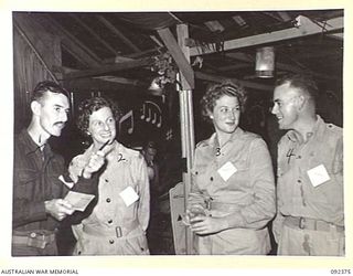 LAE, NEW GUINEA, 1945-05-23. GROUP AT A PARTY AT NUMBER 3 SERGEANTS' MESS HEADQUARTERS FIRST ARMY. IDENTIFIED PERSONNEL ARE:- LANCE-SERGEANT B. REDDAWAY (1); SERGEANT L. WILSON (2); SERGEANT R. ..