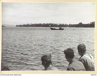 SORAKEN PENINSULA, BOUGAINVILLE. 1945-09-14. A MOTOR LAUNCH CARRYING MEMBERS OF HEADQUARTERS 2 CORPS, PREPARED FOR SURRENDER DISCUSSIONS WITH THE JAPANESE AT A SEA RENDEZVOUS OFF SORAKEN PENINSULA, ..