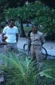 Two native men with bicycle in background, Likiep Atoll, August 20, 1949