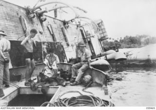 MILNE BAY, NEW GUINEA, 1943-05. ARMY DIVER PREPARING TO DESCEND INTO THE INTERIOR OF THE SS ANSHUN. THIS VESSEL WAS SUNK BY SHELLFIRE FROM A JAPANESE WARSHIP DURING THE MILNE BAY INVASION, 1942-08 ..