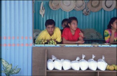 Group of children behind counter