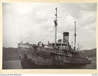 RABAUL, NEW BRITAIN. 1945-10-01. A JAPANESE TUG IN REASONABLY GOOD CONDITION WHICH IS BEING OVERHAULED FOR USE BY THE ROYAL AUSTRALIAN NAVY